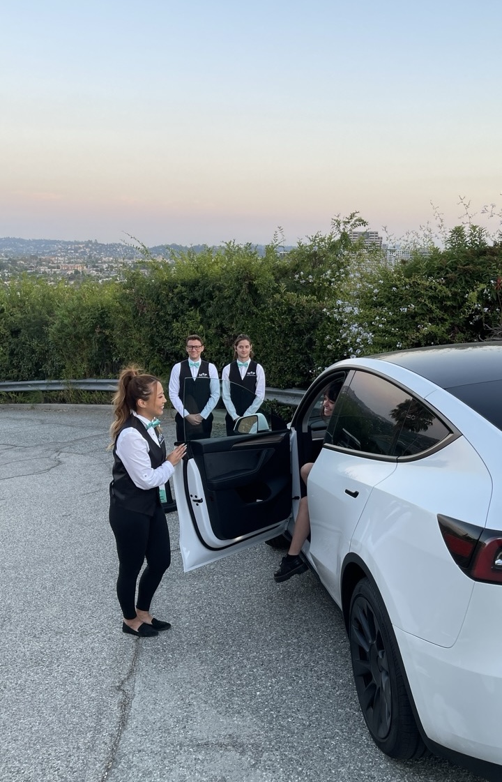 Mint Valet Parking Services attendants assisting a guest with vehicle valet in Los Angeles, ensuring professional and seamless valet service